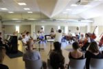 Alcune persone coinvolte nel Progetto "In-Orchestra", durante le prove presso la Fondazione Spazio Reale di Campi Bisenzio (Firenze)